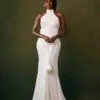 An image of a fitted wedding reception gown