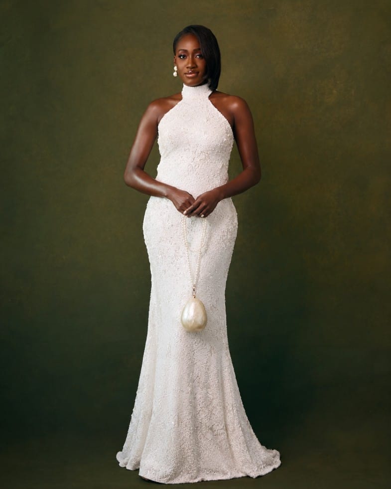 An image of a fitted wedding reception gown