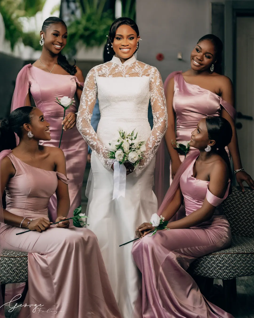 This is an image of a bride wearing her luxury wedding dress with her bridesmaids