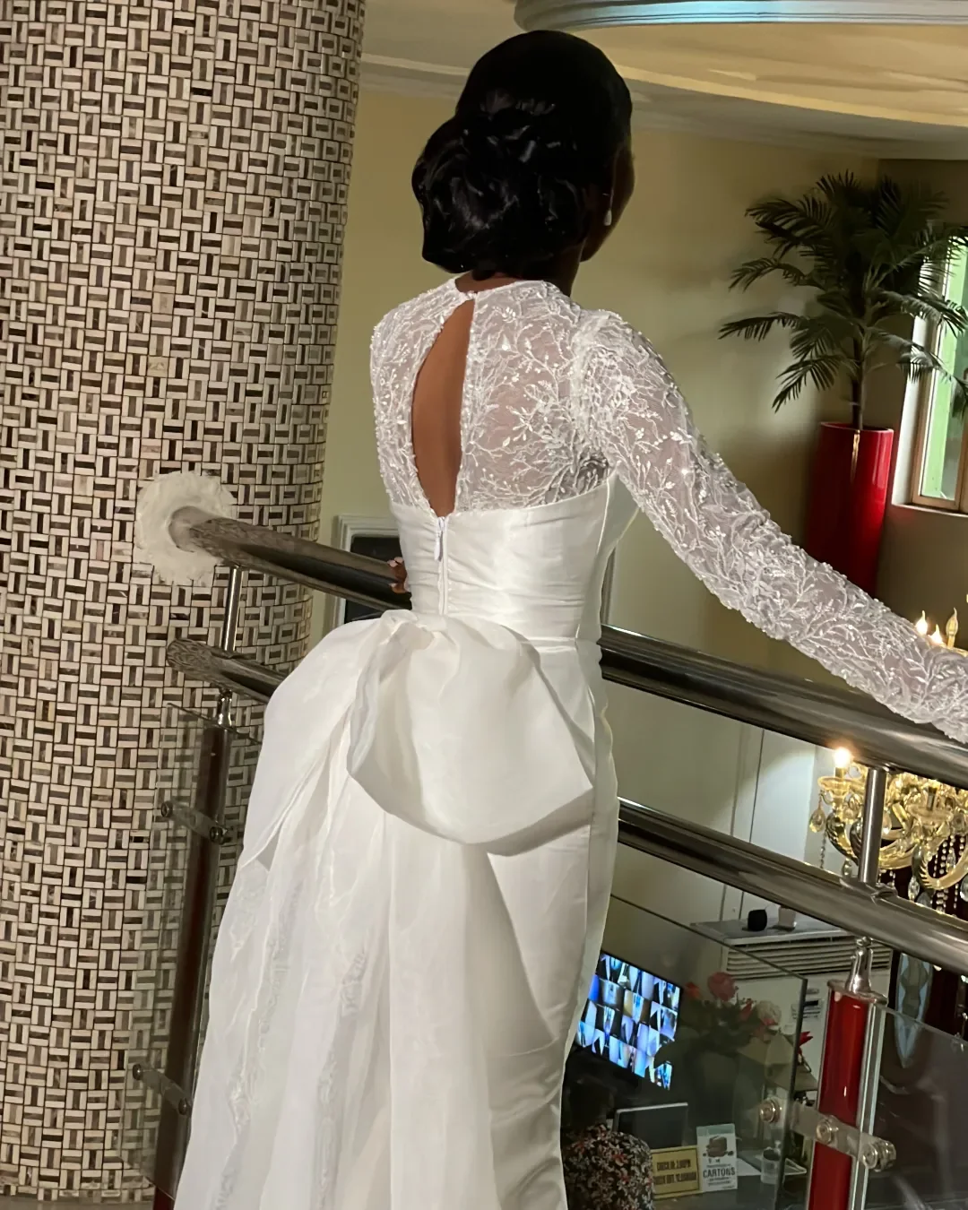 Keyhole lace back and sculptural bow detail on the Seraphine white wedding dress